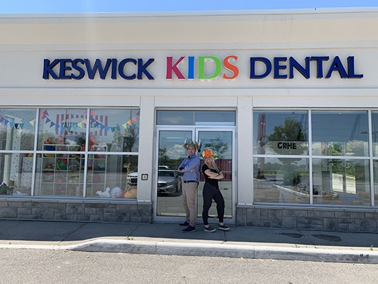 Dr. Noah and staff in front of Keswick Kids Dental Clinic