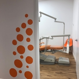 Kid friendly orange dental operating room at Keswick Kids Dental